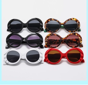 Detail view of round oversized sunglasses with textured frames in six assorted colors