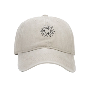 Close-up of sun and moon embroidery on washed cotton baseball cap with clean stitching