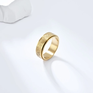Golden stainless steel Eye of Horus spinner ring with geometric engraved rotating band