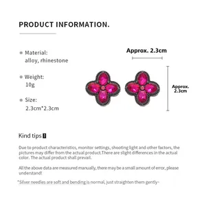 Close-up of vintage flower earrings with pink rhinestones and 2.3cm measurement display