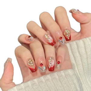 Handmade red and pink gradient press-on nails with luxury rhinestones and unicorn art