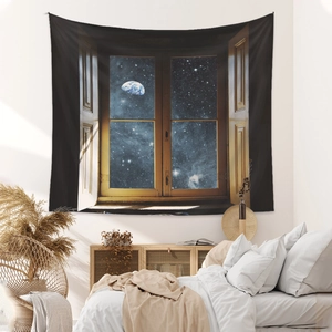 Detailed view of bohemian space tapestry with galaxy window pattern on bedroom wall