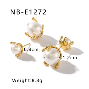 Detail view of 0.8cm and 1.2cm pearl stud earrings in gold claw setting