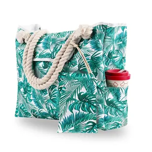 Detailed view of tropical palm print beach tote bag with thick rope handles and side pocket