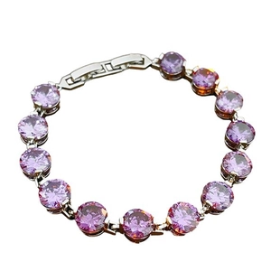 Silver tennis bracelet featuring round purple cubic zirconia stones in a circular layout