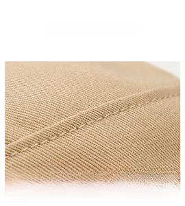 Close-up of khaki cotton twill fabric with precise double-row stitching on sport cap