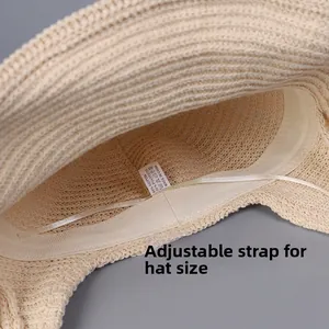 Close-up of internal sweatband and adjustable drawstring on beige knit sun hat