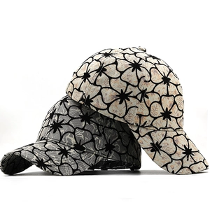 Floral print baseball cap in beige and grey colors with a classic curved brim design