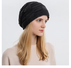 Detail of dark grey slouchy beanie showing textured knit pattern and comfortable fit