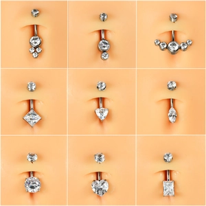 Detailed display of G23 titanium belly rings with various zircon shapes on silicone models
