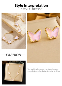 Macro detail of gold plated butterfly jewelry set with pink iridescent butterfly charms