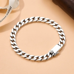 Polished silver Miami Cuban link chain bracelet for men featuring a secure box clasp