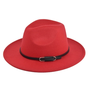 Detail of red wool fedora with a black belt trim and silver metal buckle accent