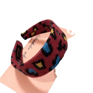 Handmade leopard print knit headband in red blue and yellow retro pattern