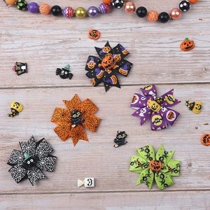 Detailed set of five Halloween bow hair clips with pumpkin and spider resin motifs