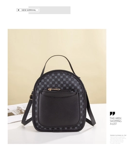 Detailed view of vintage black PU leather backpack with geometric pattern and front pocket