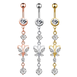 Detailed view of three butterfly zircon belly rings in rose gold, silver, and gold finishes