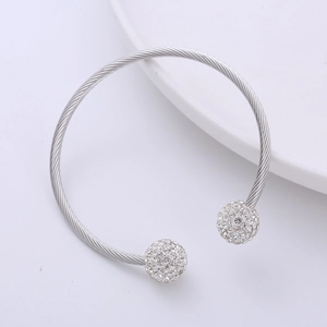 Macro shot of silver twisted rope open cuff bracelet with two sparkling crystal pavé balls