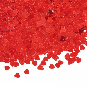 Sparkling red heart-shaped PVC sequins for Valentine's Day party decor on white background