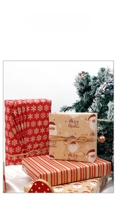 Close-up of vintage kraft Christmas wrapping paper with reindeer and snowflake patterns