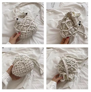 Detailed close-up of beige handmade crochet crossbody bag with drawstring closure and wood beads