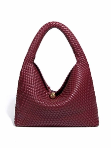 Burgundy woven leather hobo bag with distinctive gold ball clasp in a sleek minimalist style