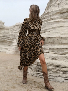Close-up of leopard print maxi dress with long sleeves and elegant mock neck detailing