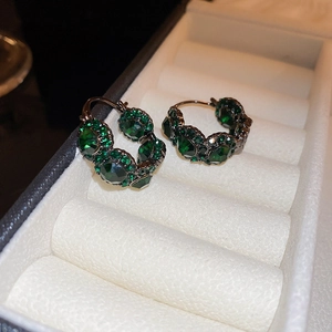Vintage green crystal hoop earrings with geometric rhinestones in dark metal setting