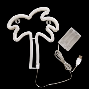 Detail of coconut tree neon LED light showing dual USB and battery power options