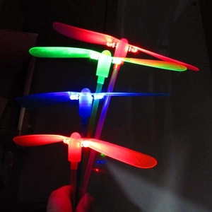 Handheld glowing LED dragonfly toys for kids in vibrant red, green and blue colors