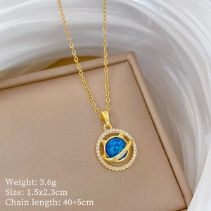 Detailed view of gold planet necklace with blue opal stone and pavé crystal accents