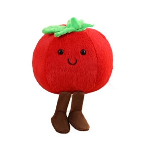 Cute tomato plush toy with smiling face and green leaves on a clean white background