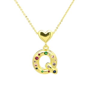Close-up of golden letter Q pendant with multi-colored cubic zirconia and heart bail