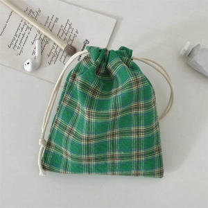 Green and white plaid drawstring fabric bag for small items with cotton rope closure