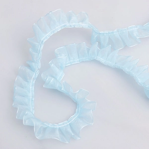 Close-up of 2.5cm light blue pleated organza lace trim for DIY sewing and dress making