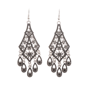 Vintage silver hollow flower drop earrings with bohemian style and tassel details