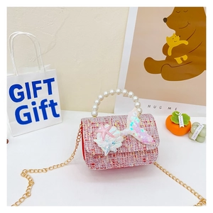 Detail of pink tweed sequin mermaid princess bag with pearl handle and starfish decor