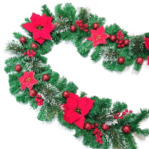 Detail of 2.7m Christmas garland with red poinsettia flowers and snowy pine needles