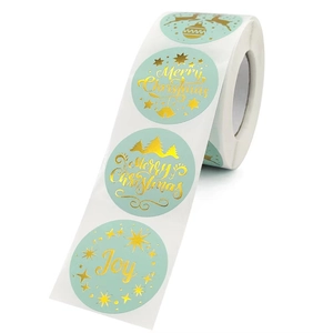 Roll of mint green Christmas stickers with gold foil Merry Christmas and deer patterns