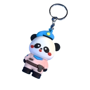 Cute panda keychain with pink uniform and blue beret on white background