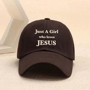 Dark brown Just A Girl Who Loves Jesus baseball cap with embroidery on a beige background