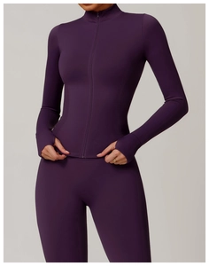 Detail of purple yoga jacket cuff with thumbhole design and elastic seam stitching