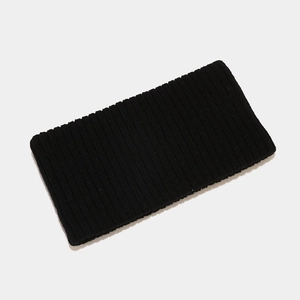 Detail of black ribbed knit texture on a seamless sports headband for men and women