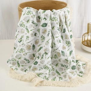 Breathable cotton muslin baby swaddle blanket with floral print and tassel fringe