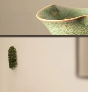 Close-up of agate-glazed ceramic tea strainer with kiln-changed emerald star texture