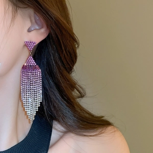 Detailed view of elegant gradient purple tassel earrings with sparkling rhinestones