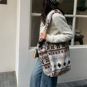 Detailed shot of plush winter tote bag with Nordic geometric patterns and wide shoulder strap