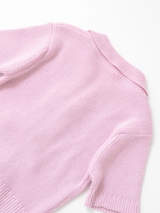 Close-up of light pink ribbed knit polo shirt with delicate collar and short sleeves detail