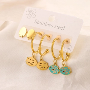 Detailed shot of 18K gold plated stainless steel stud earrings with blue enamel fish charms
