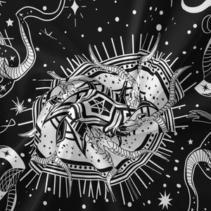 Detailed view of tarot tapestry fabric featuring mystic snake, moon and stars pattern